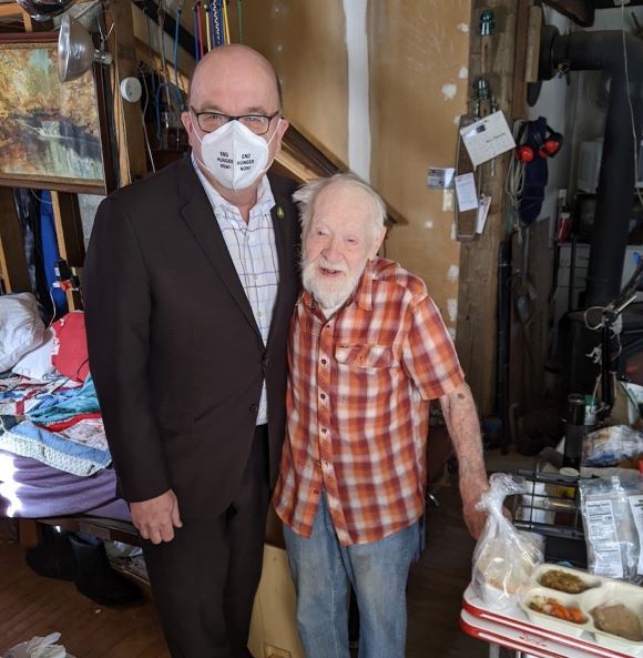 Jim delivering a meal to a senior