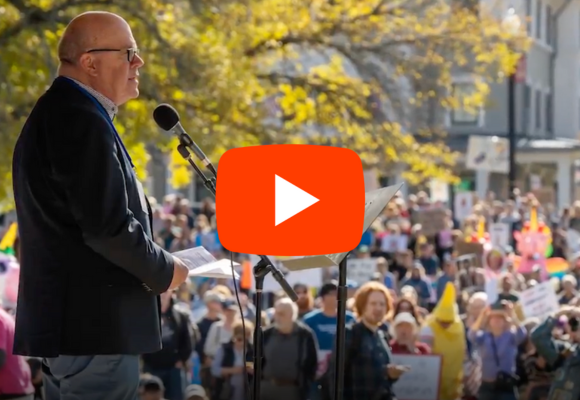 Jim McGovern speaking in front of a crowd at the No Kings Rally in Worcester